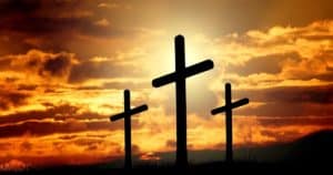 Three crosses at sunset — symbol of faith